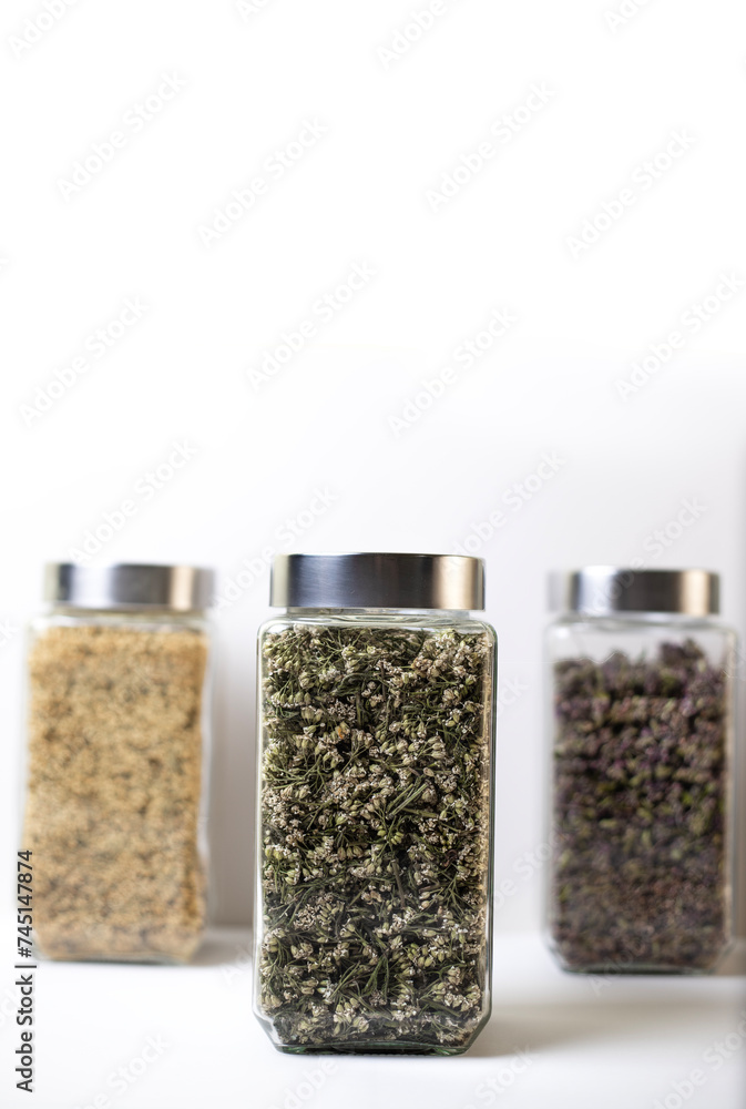 Healthy herbs for tea. Herbs in a glass container. Healthy herbs for tea. Herbs in a glass container.