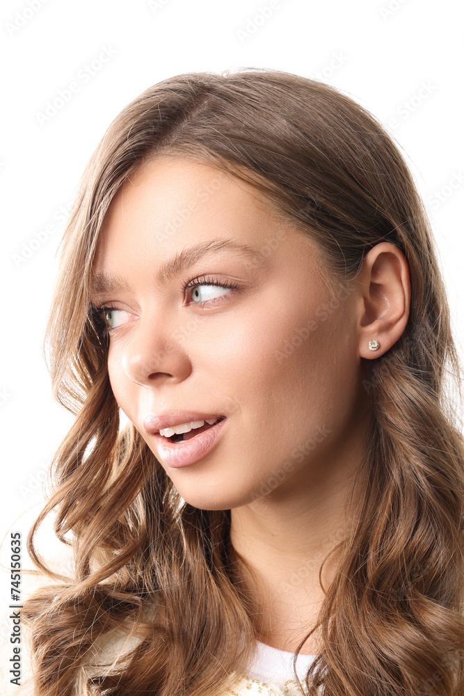 Beautiful young girl with fresh healthy skin. Woman advertise ear-rings. White background. Earrings closeup. Blond european woman with long hair with big lips, pretty smile. Cosmetology, scincare Beautiful young girl with fresh healthy skin. Woman advertise ear-rings. White background. Earrings closeup. Blond european woman with long hair with big lips, pretty smile. Cosmetology, scincare