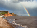 A rainbow over Sidmouth beach in Devon, UK.