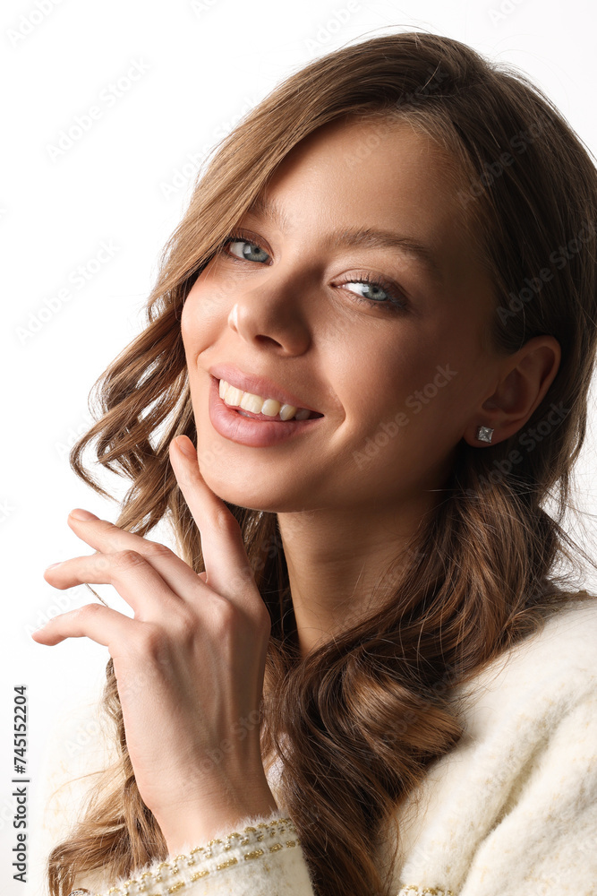 Beautiful young girl with fresh healthy skin. Woman advertise ear-rings. White background. Earrings closeup. Blond european woman with long hair with big lips, pretty smile. Cosmetology, scincare Beautiful young girl with fresh healthy skin. Woman advertise ear-rings. White background. Earrings closeup. Blond european woman with long hair with big lips, pretty smile. Cosmetology, scincare