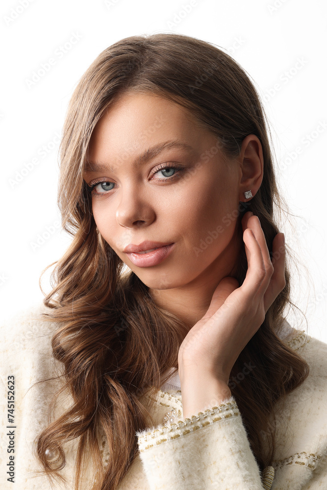 Beautiful young girl with fresh healthy skin. Woman advertise ear-rings. White background. Earrings closeup. Blond european woman with long hair with big lips, pretty smile. Cosmetology, scincare Beautiful young girl with fresh healthy skin. Woman advertise ear-rings. White background. Earrings closeup. Blond european woman with long hair with big lips, pretty smile. Cosmetology, scincare