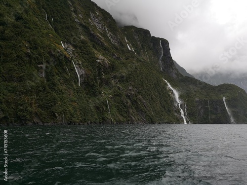Fiordland National Park with amazing views of the mountains covered in clouds.