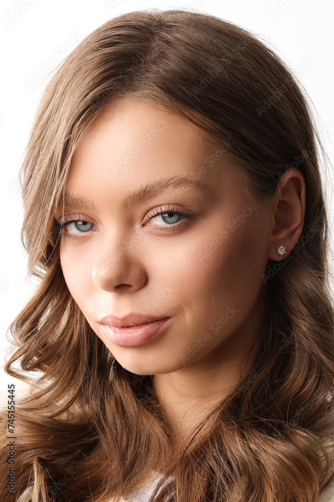Beautiful young girl with fresh healthy skin. Woman advertise ear-rings. White background. Earrings closeup. Blond european woman with long hair with big lips, pretty smile. Cosmetology, scincare Beautiful young girl with fresh healthy skin. Woman advertise ear-rings. White background. Earrings closeup. Blond european woman with long hair with big lips, pretty smile. Cosmetology, scincare