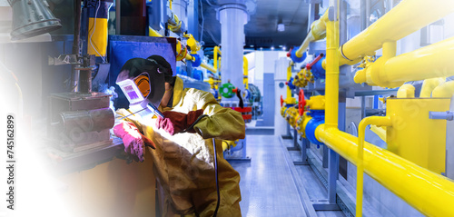 Welder at work. Man welding...