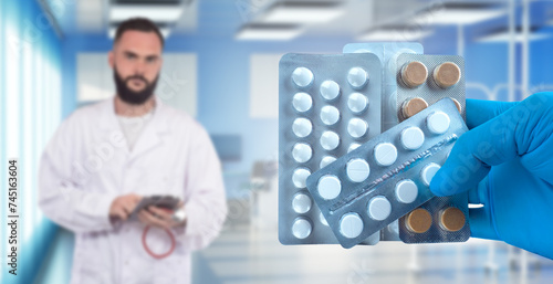 Pills in doctor hands. Blis...