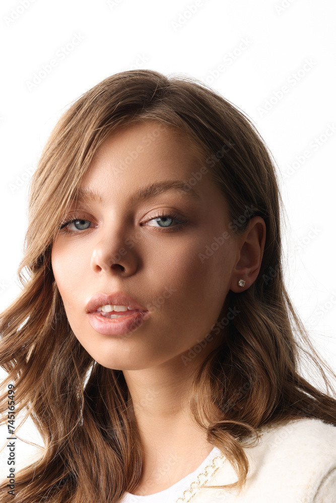 Beautiful young girl with fresh healthy skin. Woman advertise ear-rings. White background. Earrings closeup. Blond european woman with long hair with big lips, pretty smile. Cosmetology, scincare Beautiful young girl with fresh healthy skin. Woman advertise ear-rings. White background. Earrings closeup. Blond european woman with long hair with big lips, pretty smile. Cosmetology, scincare