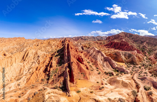 Aerial top view to beautiful landscape of Skazka canyon. Rocks Fairy Tale - famous destination in Kyrgyzstan. Rock formations in shape of a dragon spine like great wall of china on Issyk-Kul lake.