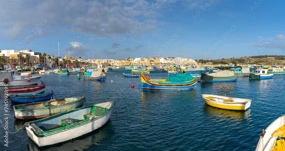 colorful fishing boats in the harbor of Marsaxlokk in southeastern Malta