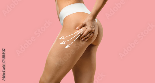 Cropped of slim young woman in underwear doing anti-cellulite massage