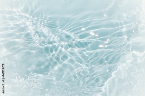 Blue water surface texture with ripples  splashes  and bubbles. Abstract summer banner background Water waves in sunlight with copy space cosmetic moisturizer micellar toner emulsion. Blue water wave.
