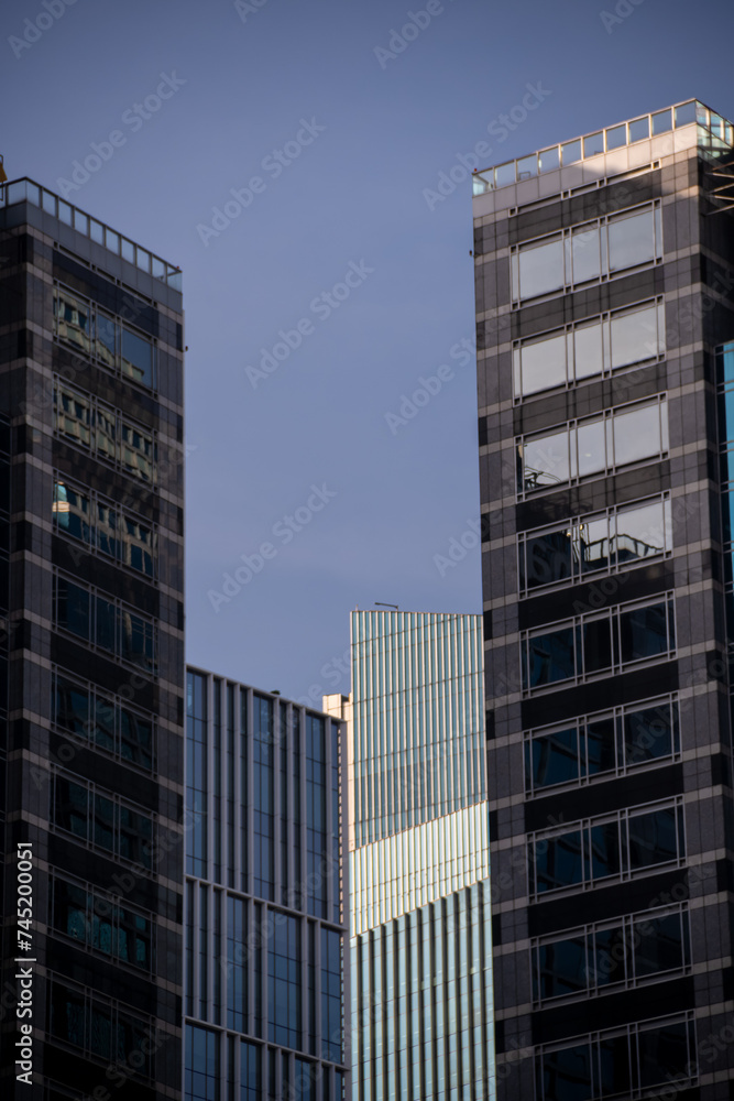 The different blue-toned glass windows of the Jakarta skyscrapers The different blue-toned glass windows of the Jakarta skyscrapers