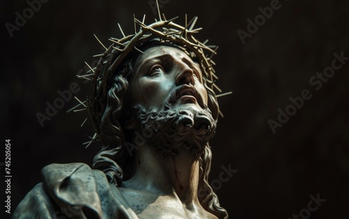 A statue depicting Jesus with a crown of thorns on his head, symbolizing his suffering and crucifixion