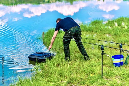 Obraz na płótnie Fishing on a beautiful spring lake w salonie