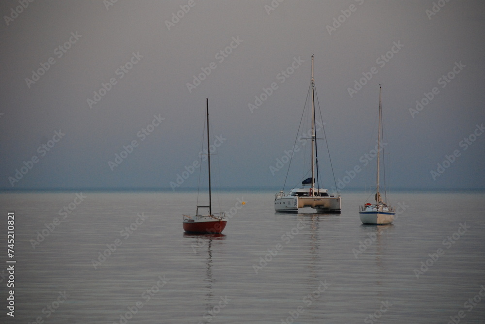 Fototapeta premium fishing boats at sunset