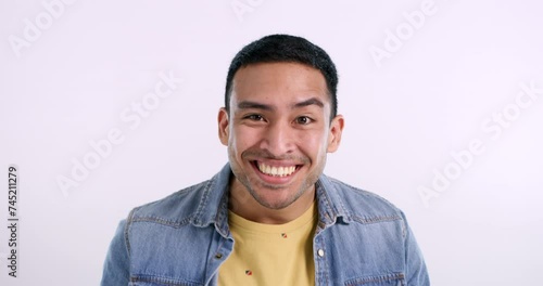 Man, humor and funny face in studio for crazy joke, mockup space and silly emoji by white background. Asian male person, dancing and energy or isolated on backdrop, happy and cool fashion in portrait photo