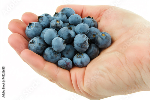 Hand holding fresh blueberries with a clear, white background, perfect for healthy eating concepts or nutritional information with space for text