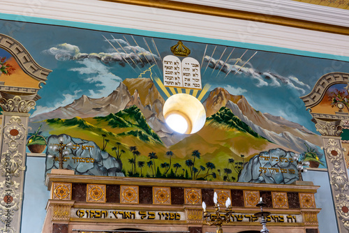 Kutaisi Synagogue altar wall richly decorated with painting of Mount Sinai and the Decalogue with window skylight symbolizing God, Georgia photo