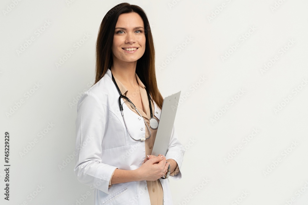 Portrait of an attractive young female doctor in white coat. Portrait of an attractive young female doctor in white coat.
