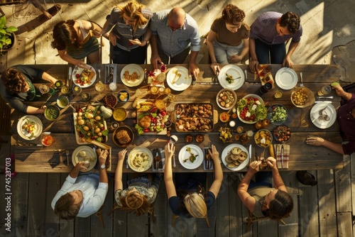 Overhead View of Families Enjoying a Dinner Feast at an Outdoor Restaurant Table on Vacation