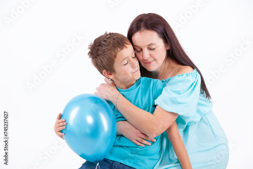 Happy mother with son on a light background