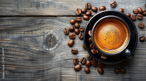 Espresso, coffee, in dark cup with beans on dark wood surface. Top view with copy space. Background, wallpaper. Breakfast. Coffee. Espresso. Caffeine.  photo