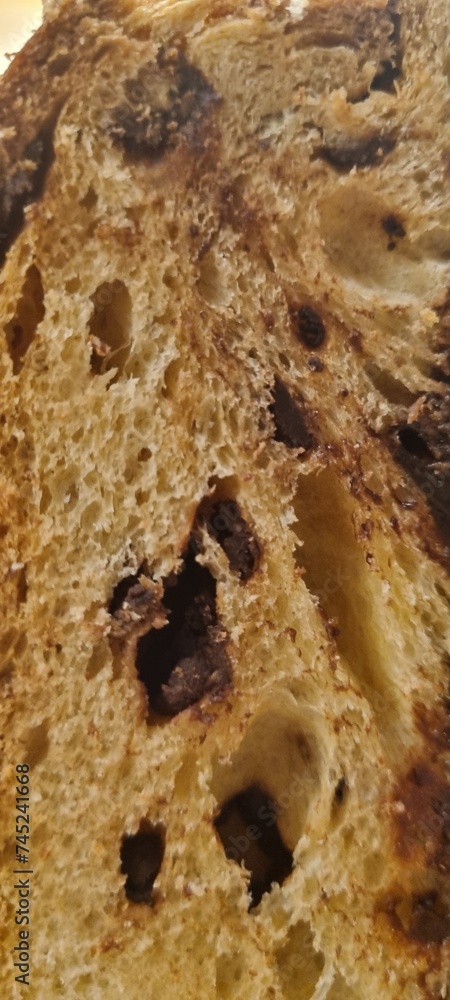 Detailed view of a freshly cut slice of homemade bread with chocolate chips