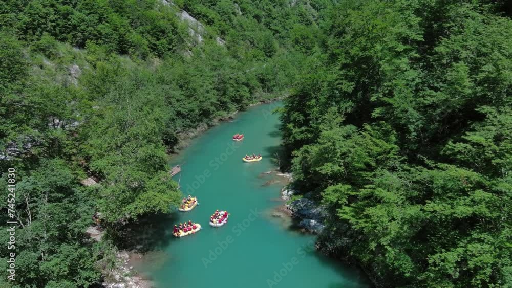 Aerial view of rafting boats on turquoise mountain river. Tara river canyon in Montenegro, 4k Aerial view of rafting boats on turquoise mountain river. Tara river canyon in Montenegro, 4k