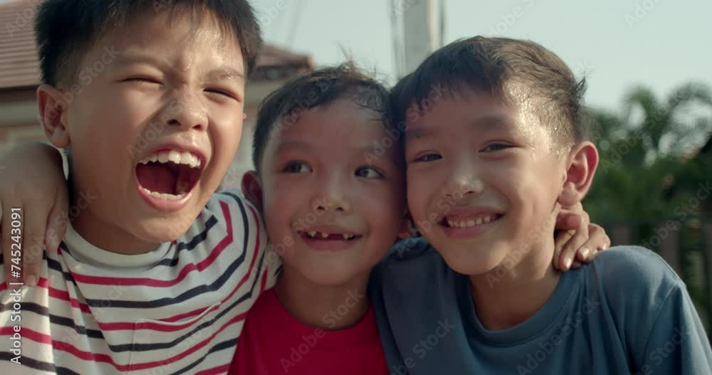 A group of elementary school-age Asian boys who were neighbors' children met up to play on the village streets in the evening after returning from school. A group of elementary school-age Asian boys who were neighbors' children met up to play on the village streets in the evening after returning from school.