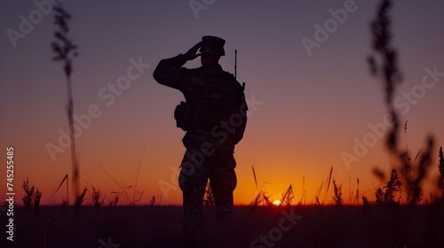 Silhouette of a soldier saluting at sunset, embodying respect, military honor, and patriotism in a serene evening backdrop