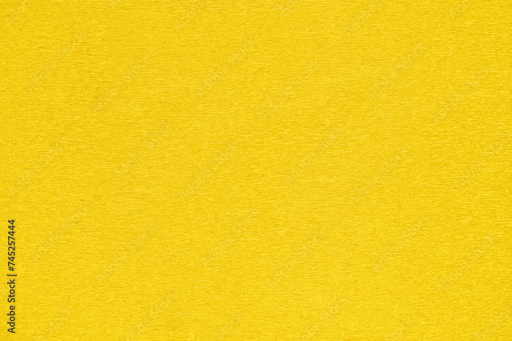 Close-up of vibrant yellow textured cardstock. Close-up of vibrant yellow textured cardstock.