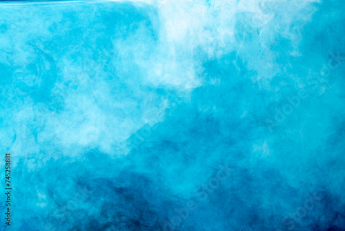 water soluble blue photograph There are patterns created by the flow of colors in the water.