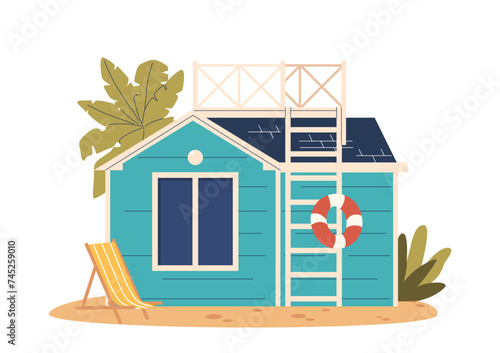 Beach House Exterior Features Blue Wood Siding, Expansive Window For Ocean Views, Roof Ladder And A Relaxed Design