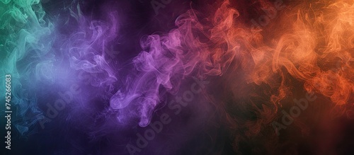 This photo shows a group of colorful smokes in motion, with shades of violet, green, and orange blending against a black background. The smokes create a vibrant and energetic visual display.