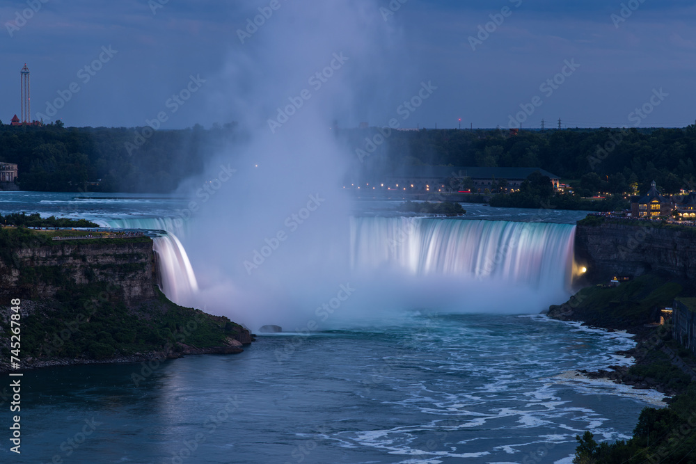 Elevated view of brightly illuminated Horseshoe falls at dusk, Niagara Falls, Canada