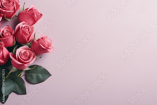 Red roses bouquet on pastel background for birthday, womens day, mothers day. Flat lay, top view