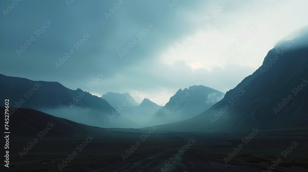 The bold outline of mountain ranges, silhouetted against a fading sky, evoking serene isolation