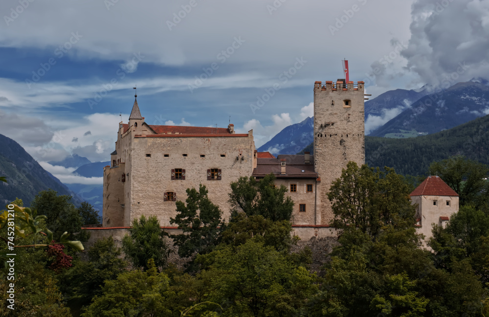 view of the ancient brunico castle on the italian alps.