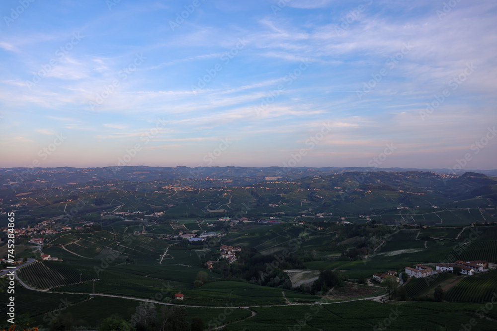 Obraz premium typical piedmontese landscape with small villages and vines in sunrise light