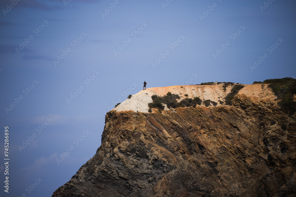 silhouette of a person on a rock silhouette of a person on a rock