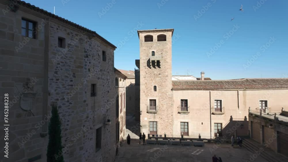Plaza with monumental buildings in medieval style in the Unesco city of Caceres, Spain. Plaza with monumental buildings in medieval style in the Unesco city of Caceres, Spain.