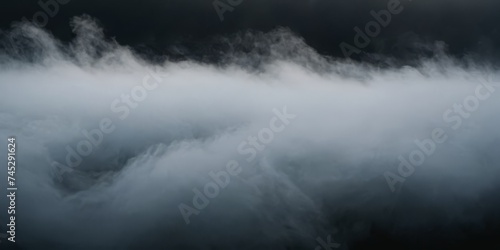 Panoramic view of an abstract fog with white cloudiness moving on a black background with copy space for text