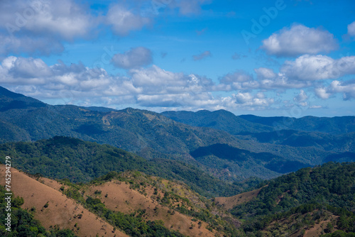 Ta Nang - Phan Dung route with milestone between 3 provinces through grass hills and forests in Song Mao Nature Reserve