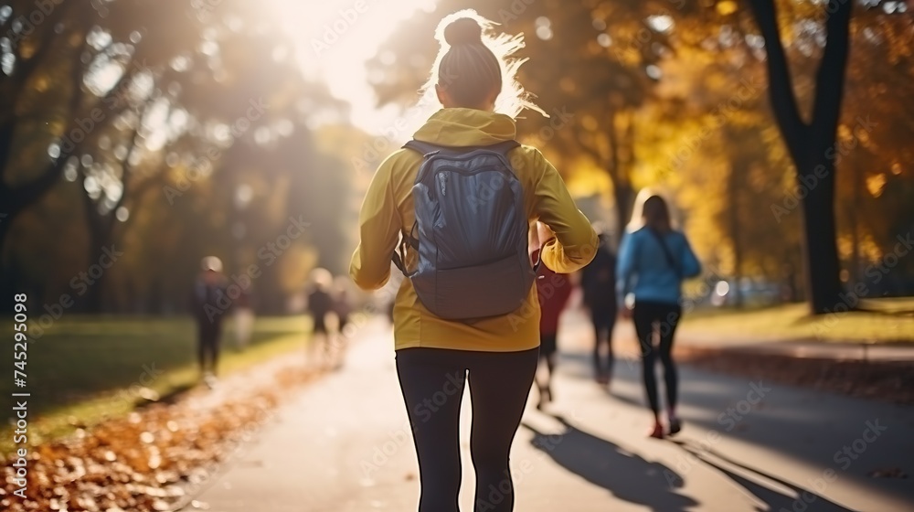 A woman in bright sportswear and sneakers, doing fitness outdoors, rucking, active jogging with a bright backpack on their back in a summer park, epitome of urban fitness trekking - obrazy, fototapety, plakaty 