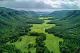 Aerial View of Green Valley Surrounded by Trees