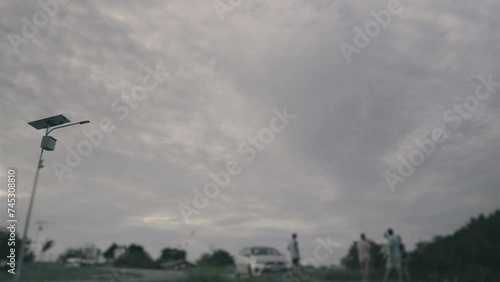 People watch an aeroplane landing in cloudy weather