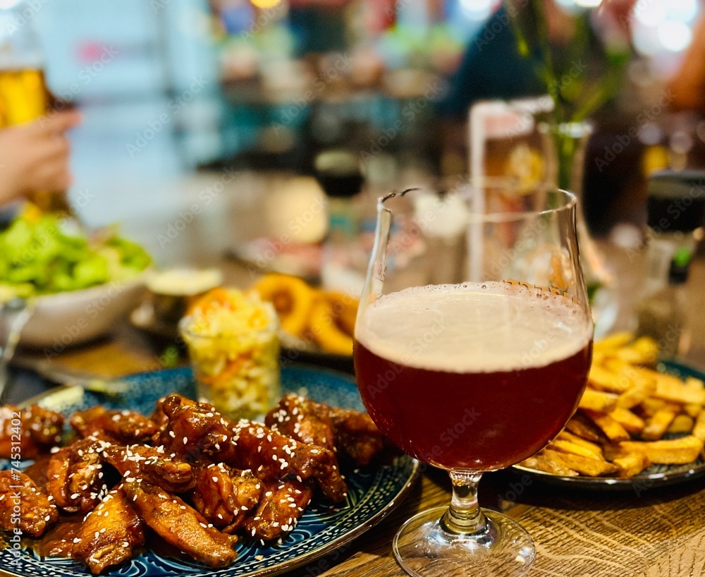 Teriyaki chicken wings under cherry souse with sesame seeds and pickled cabbage Teriyaki chicken wings under cherry souse with sesame seeds and pickled cabbage