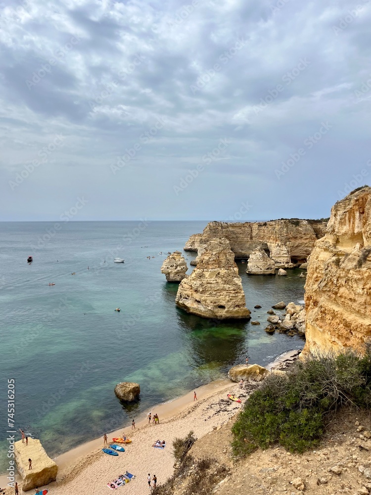 Fototapeta premium Amazing sand beach at the rocky ocean coast