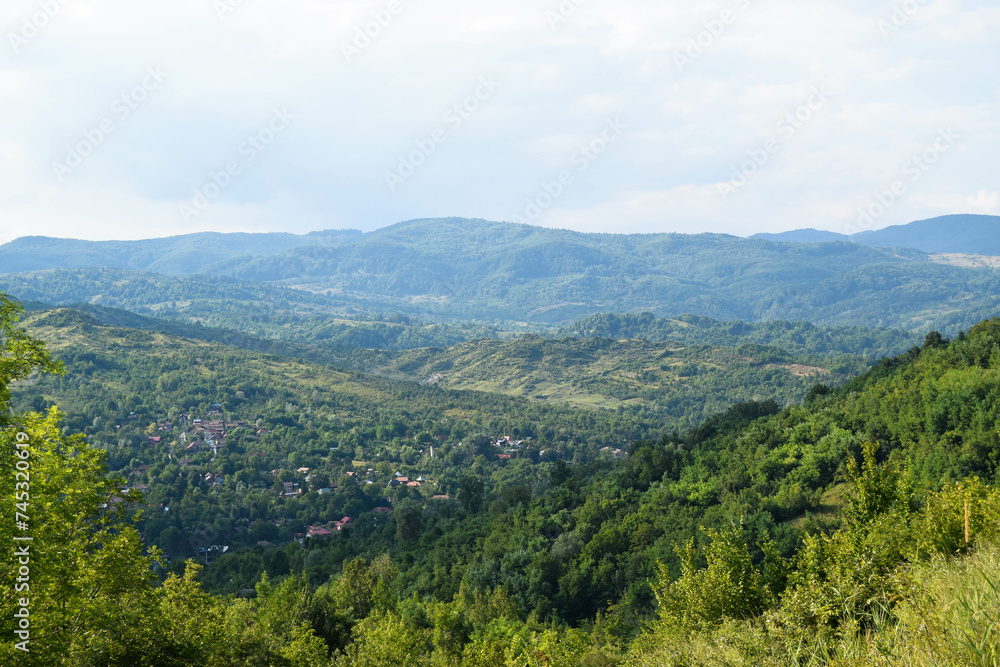 Spring mountain view of city village from Romania Carpathians top of mountain