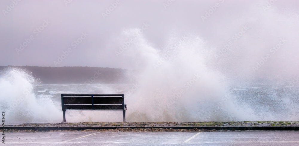 Stormy Encounter: Seaside Bench and the Fury of Nature