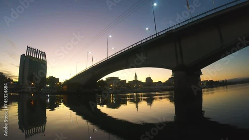 Boat ride under the Pedro de Valdivia bridge at dawn photo